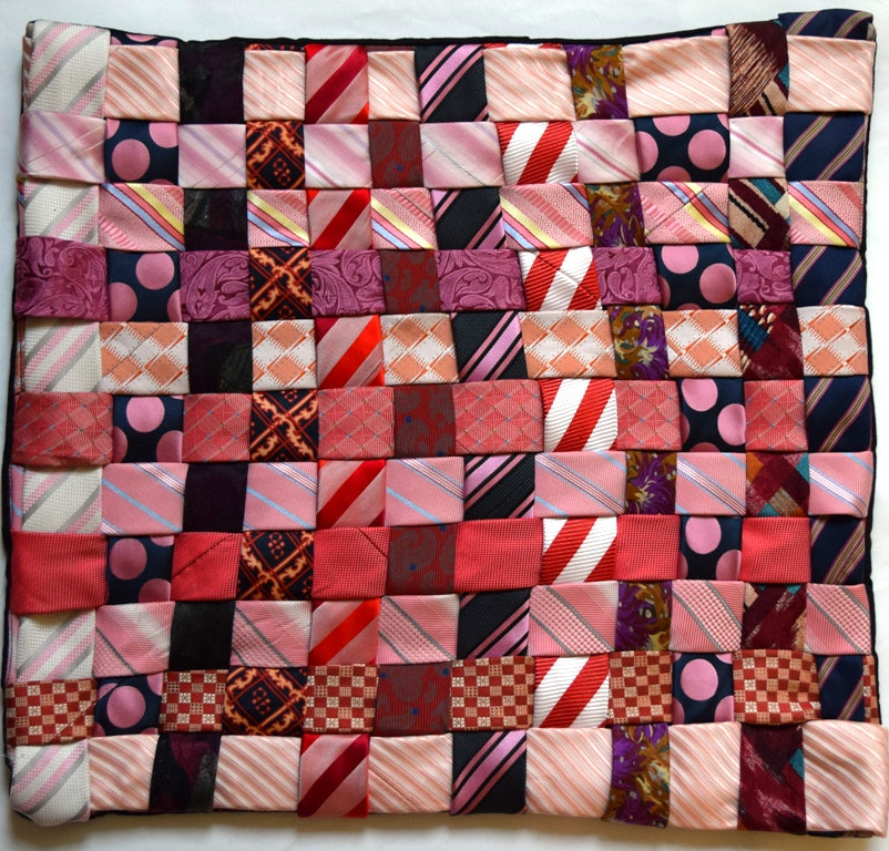 Cushion cover, woven ties, pinks